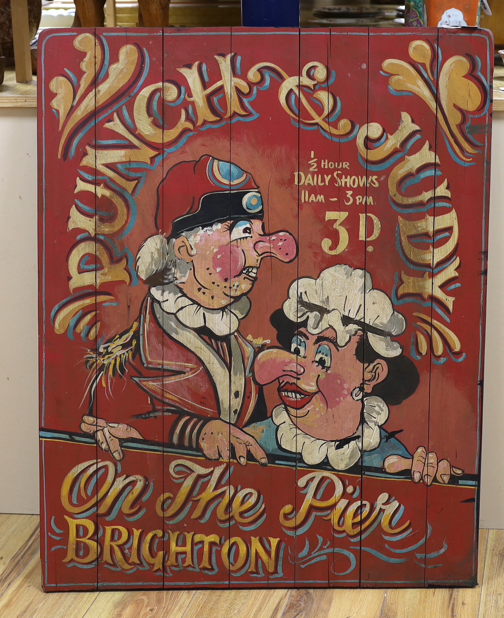 A painted wooden advertising Brighton Punch & Judy sign, 90cm high x 75cm wide